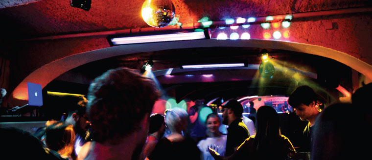 Friends celebrating on the dance floor at Isaac's